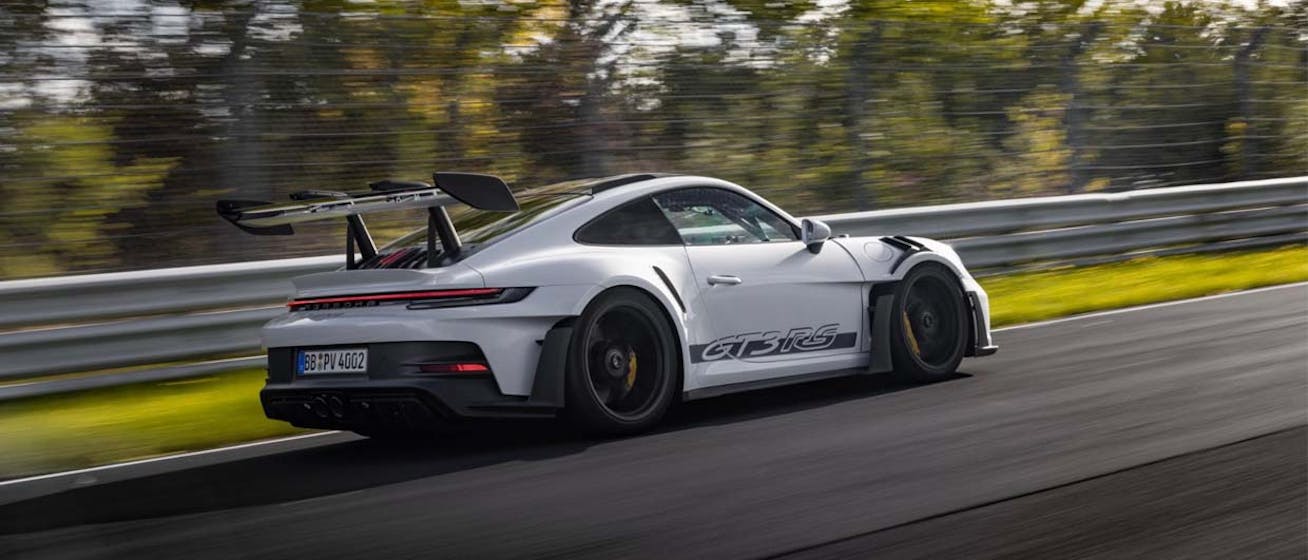 Side view of Porsche 911 GT3 RS driving on Nürburgring