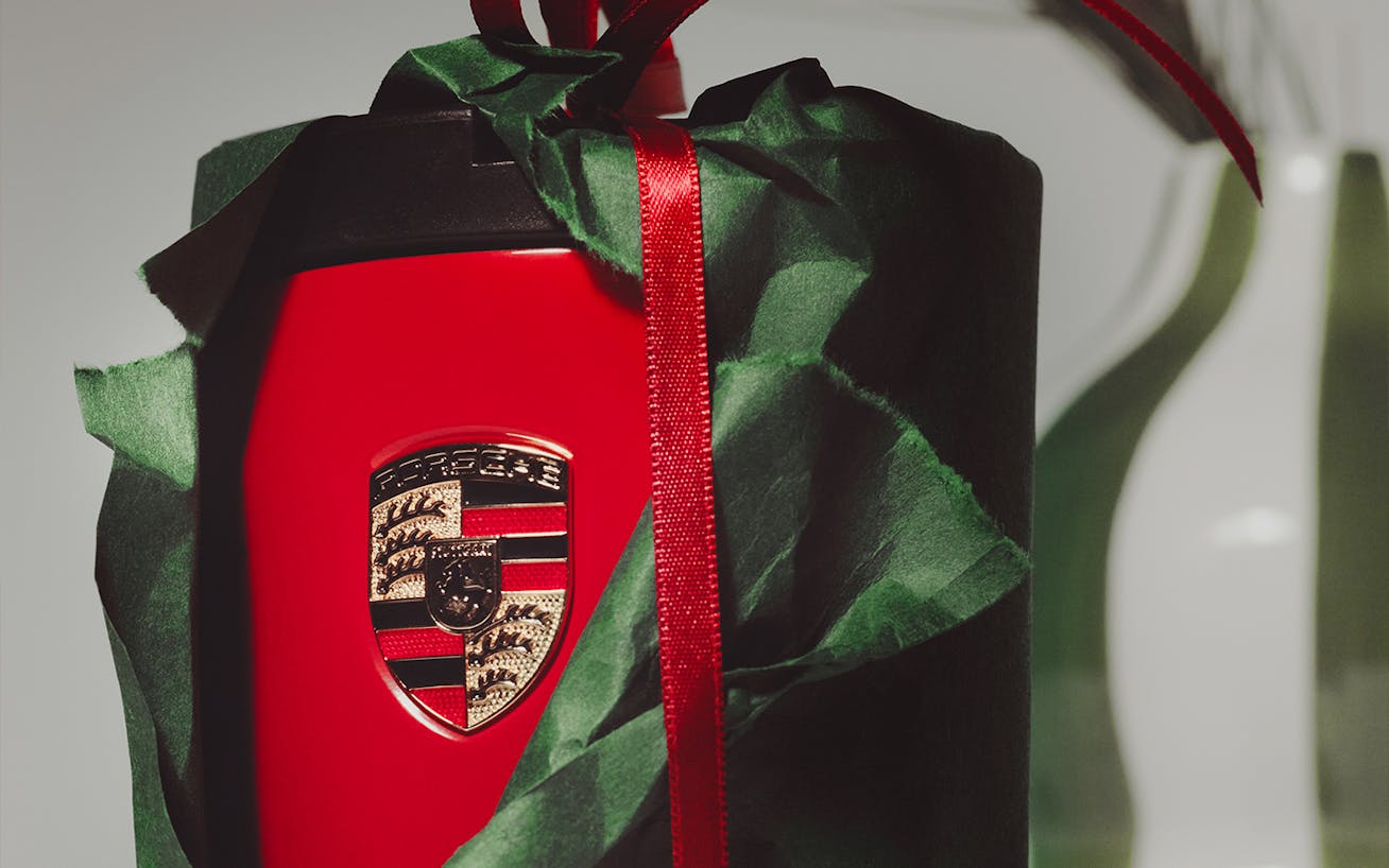 Red Porsche thermal cup wrapped as a Christmas gift 