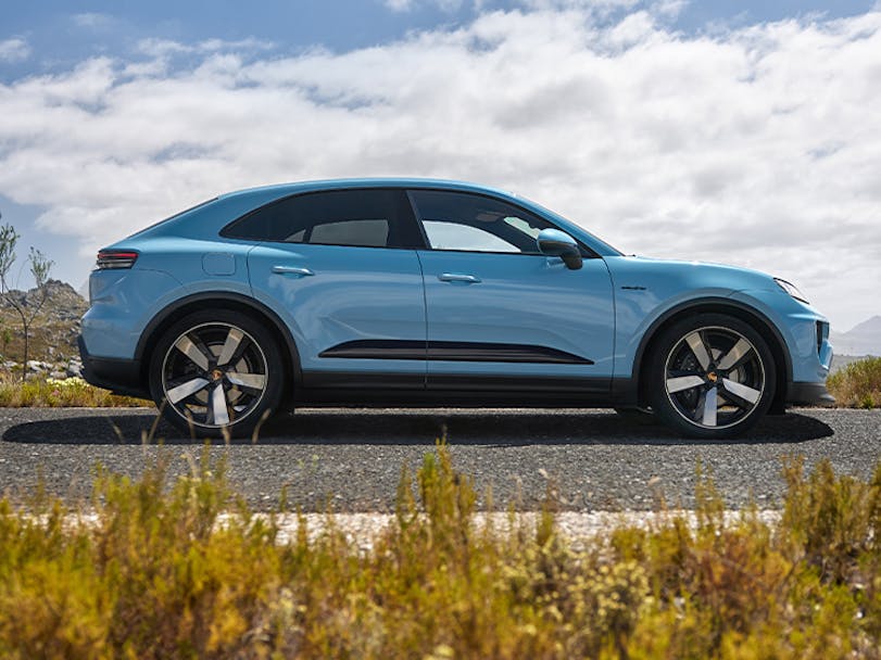 Porsche Macan Electric in Frozen Blue Metallic parked on road