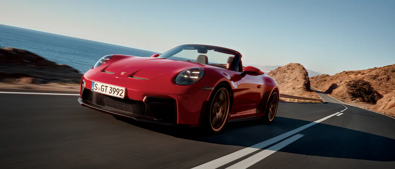 Porsche 911 GT3 SC in Guards Red on ocean road_conversion desktop