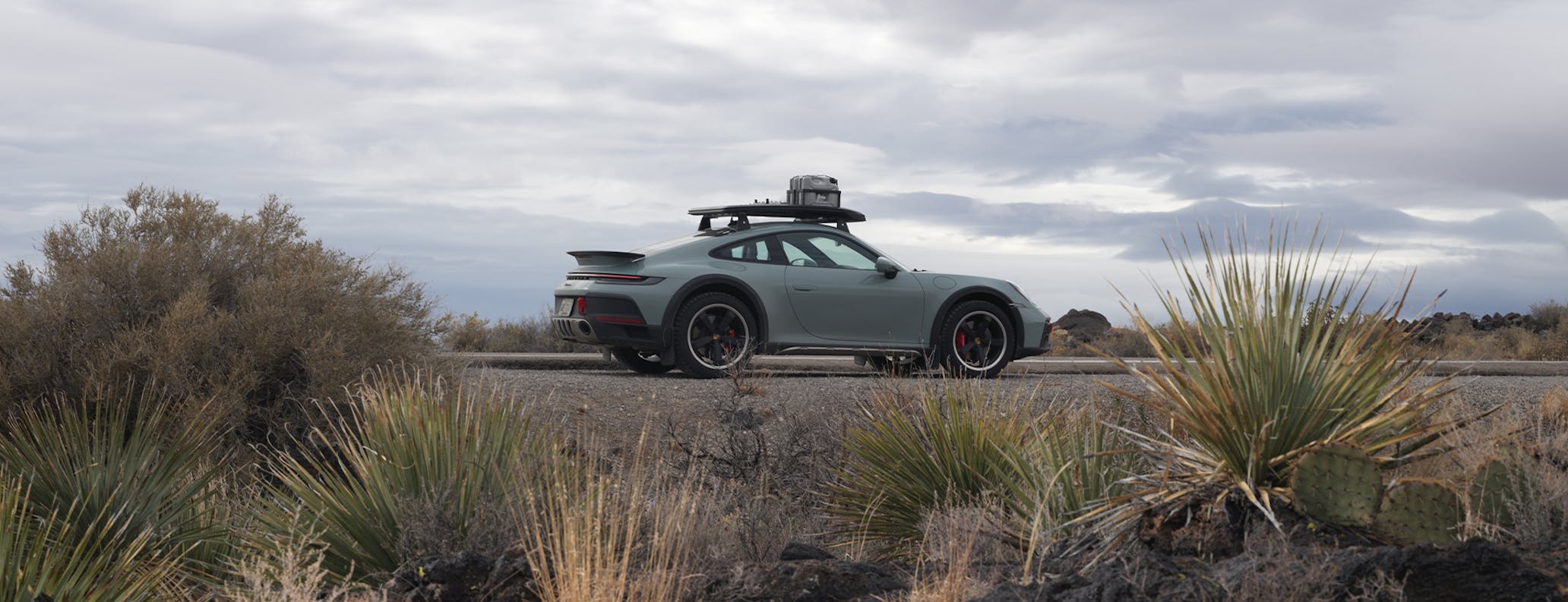 Porsche 911 Dakar in grey on desert road