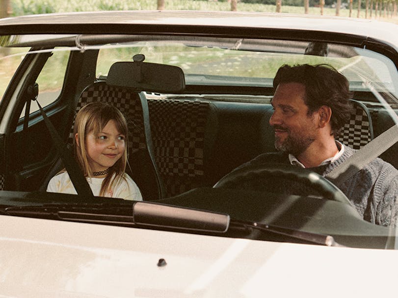 Child and man sat in Porsche 944 with interior in original Porsche Pasha material thumbnail