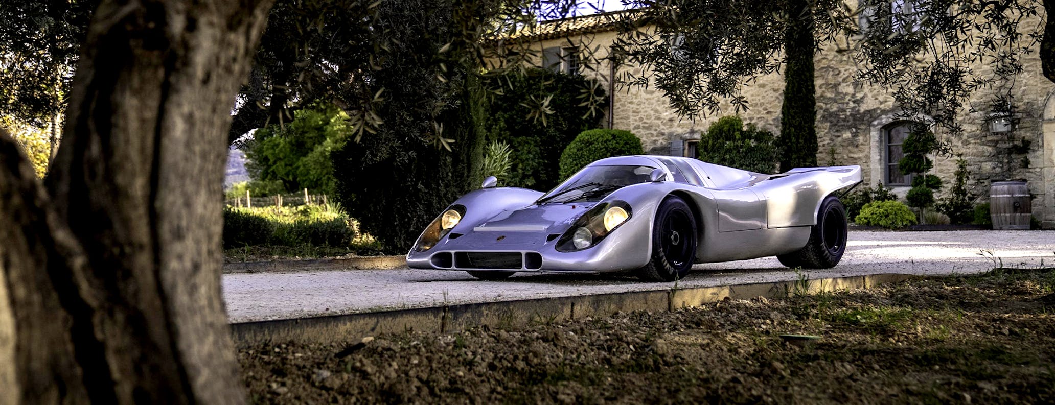 Porsche 917 KH Street parked outside country house