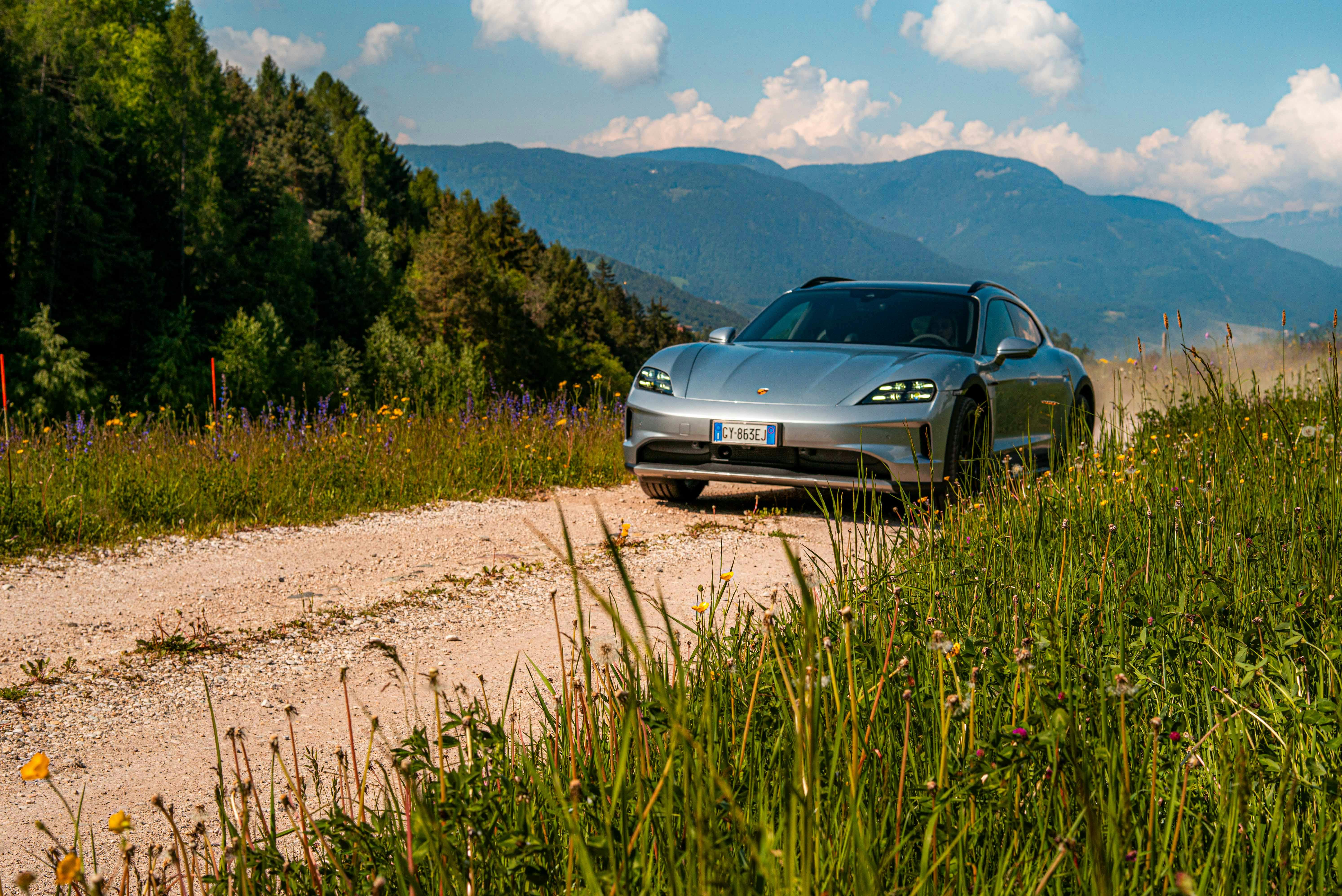 porsche taycan cross turismo driving off road dolomites