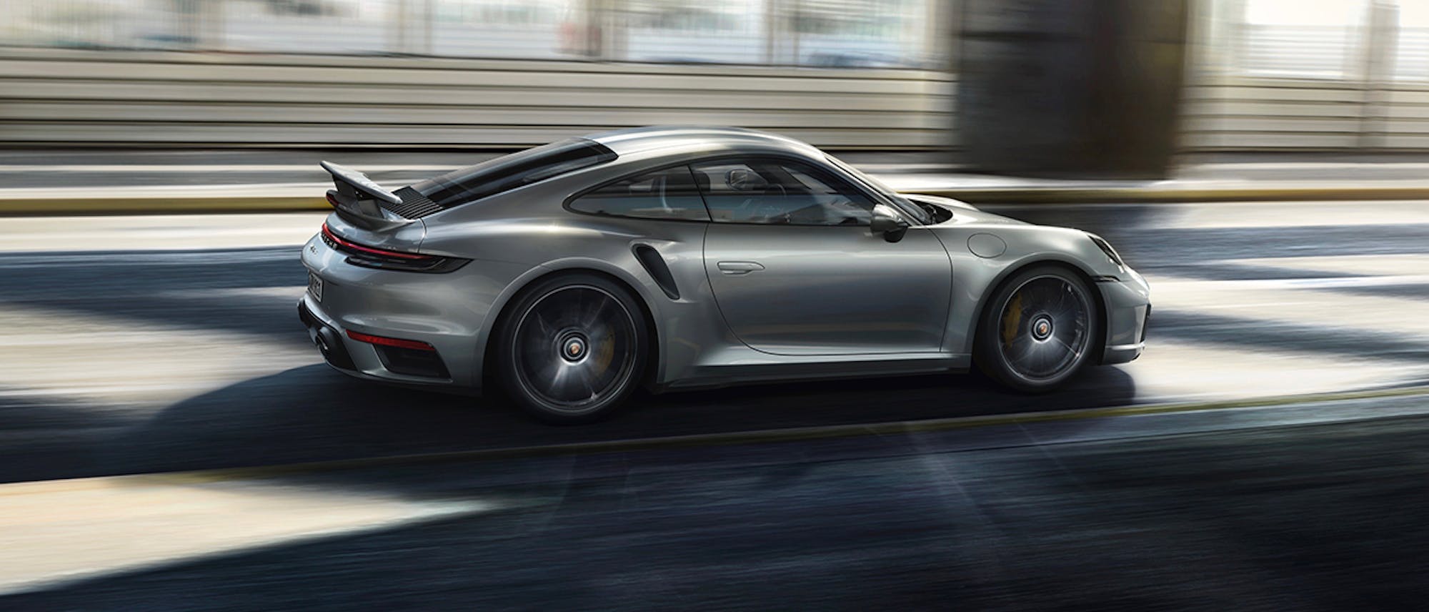 Silver Porsche 911 Turbo S (type 992) in road tunnel