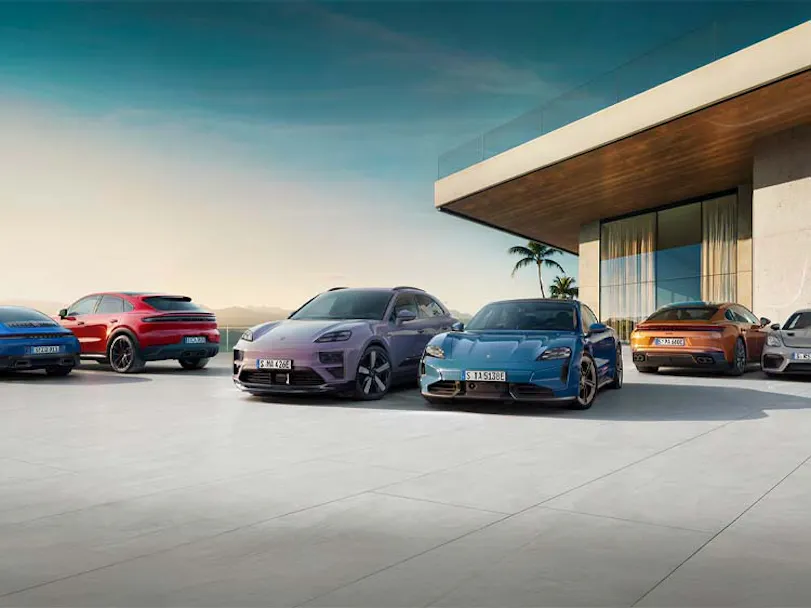 Porsche model range pictured outside modern house