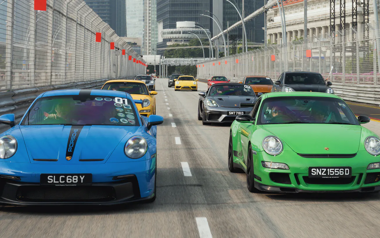 Group of Porsche cars on a road in Singapore on a meet-up at Sportscar Together Day 2026