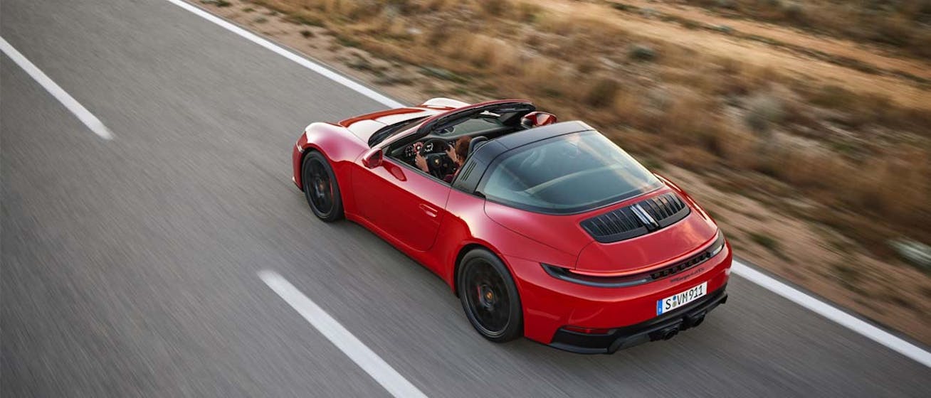 Porsche 911 Targa (type 992.2) driving on road with roof down