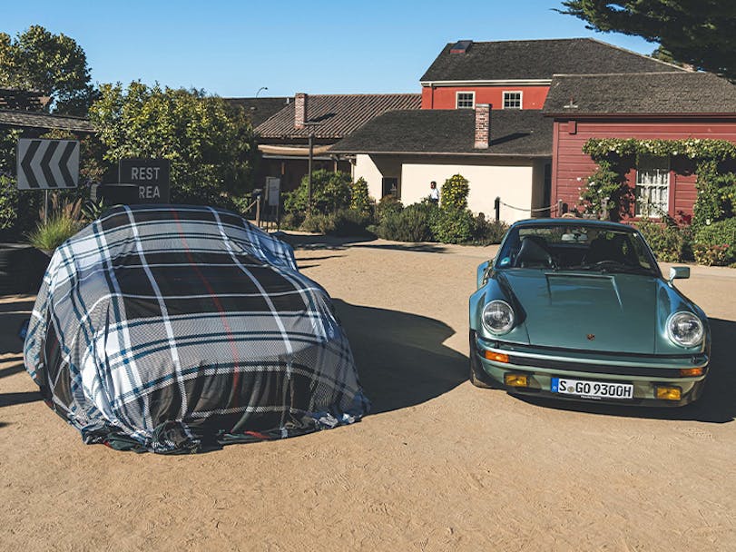 Porsche 930 Turbo with covered car at Monterey Car Week 