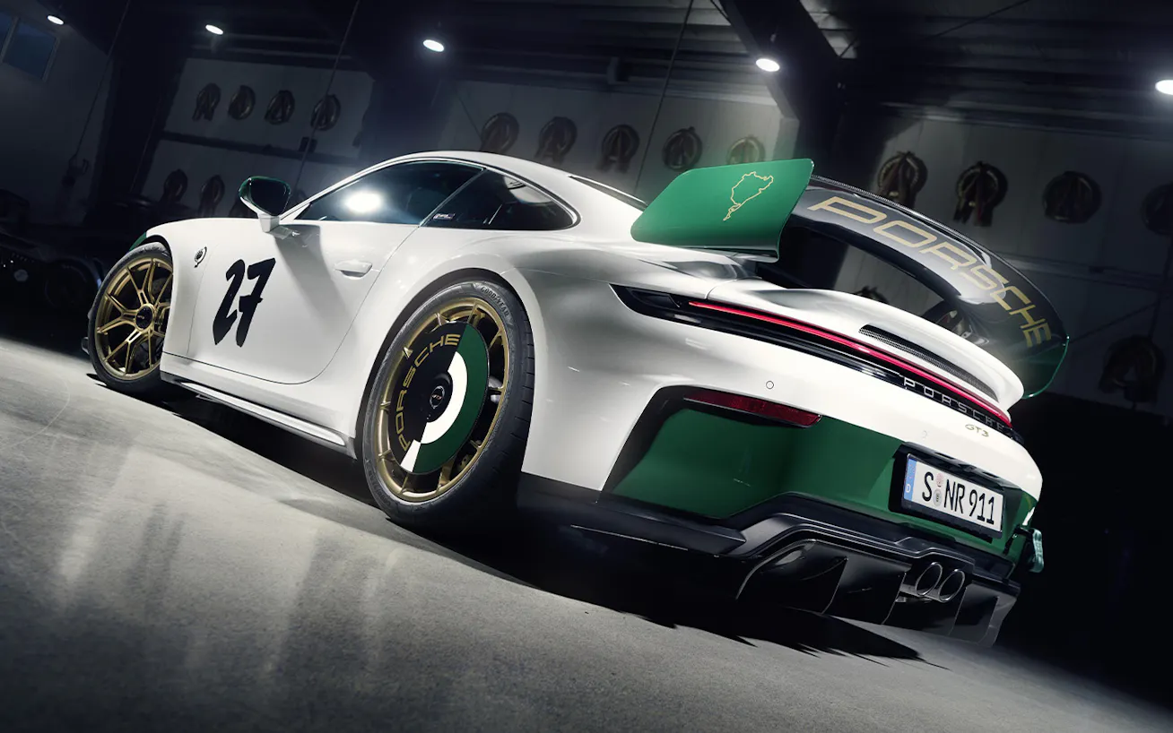 Front three-quarter view of Porsche 911 GT3 100 Jahre Nürburgring in pit lane garage at Nürburgring