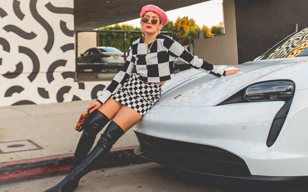 Influencer Grace Mattei leans on Porsche Taycan in LA