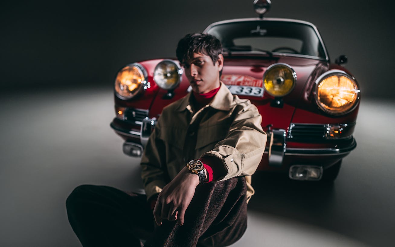 Model wearing TAG Heuer watch inspired by Porsche rally car