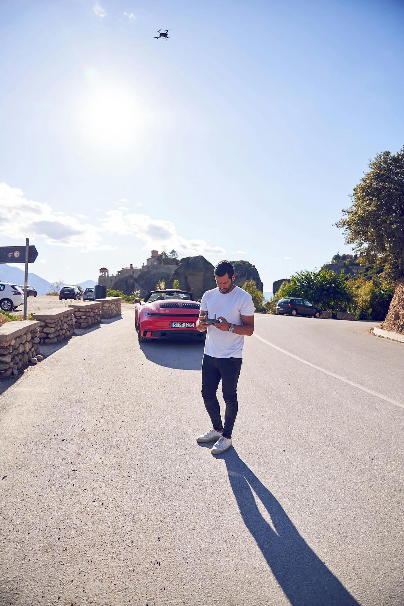 Costas Spathis with his drone and the Porsche 911 Cabriolet