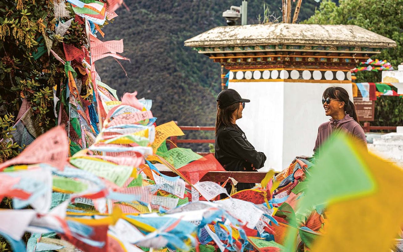 Temple complex in Shangri-La, China, decorated with colourful prayer flags