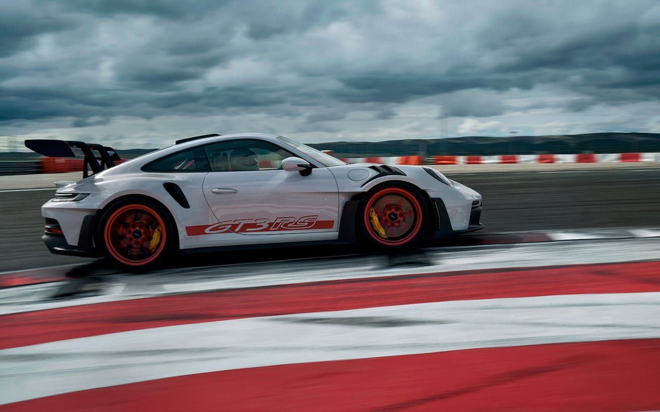 Porsche 911 GT3 RS driving through apex on racetrack