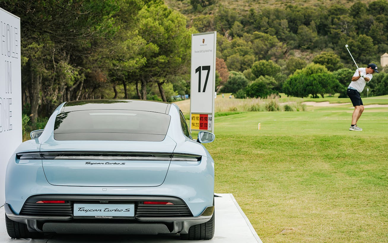 Player at Porsche Golf Cup World Final with Porsche Taycan
