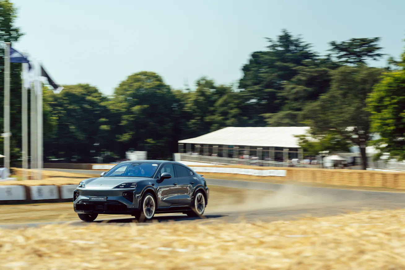 Porsche Cayenne Coupé Electric driving up the Goodwood Hillclimb 