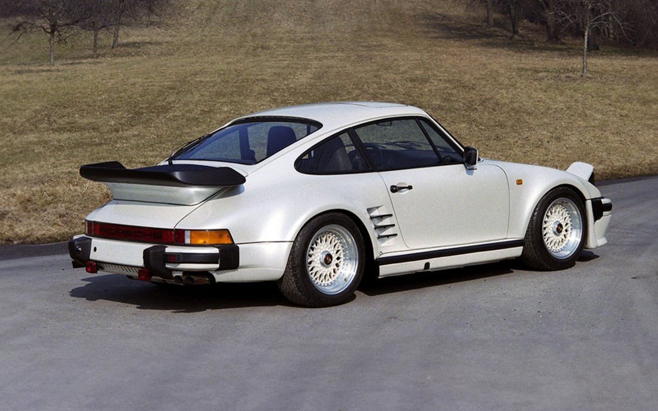 White Porsche 930 Turbo Slantnose in rear three-quarter view