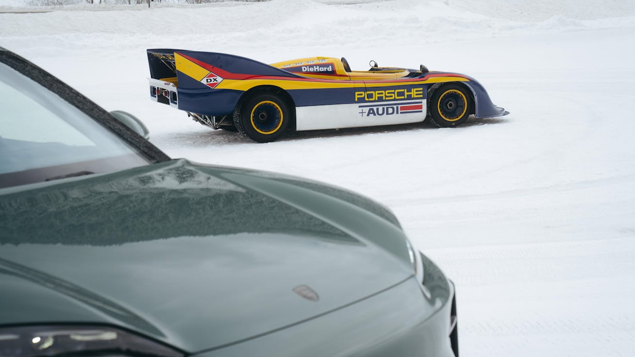 Porsche 917/30 parked on the ice at the 2026 F.A.T. Ice Race with Porsche Cayenne Electric in the foreground
