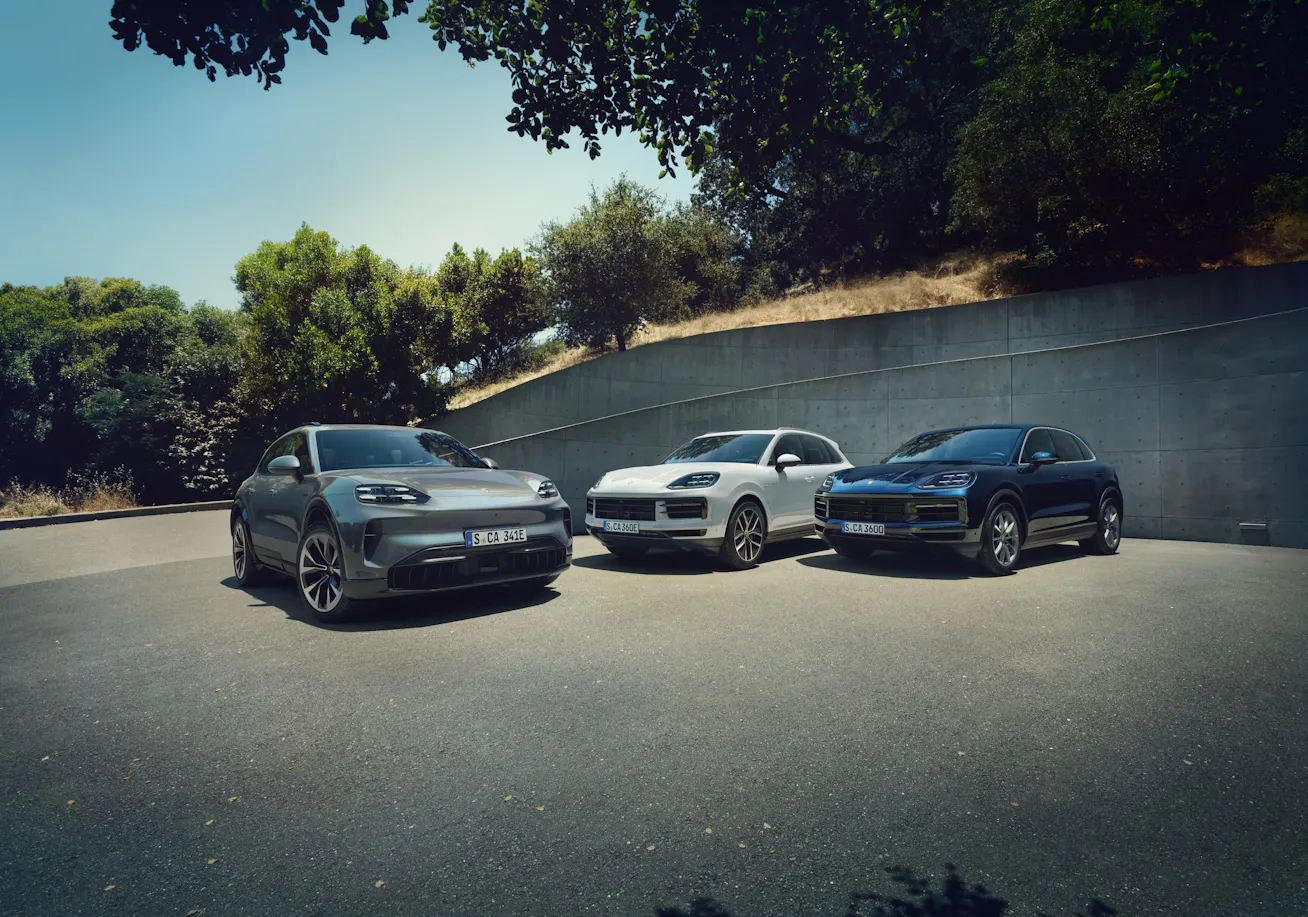 Image showing Porsche Cayenne range with modern building in background
