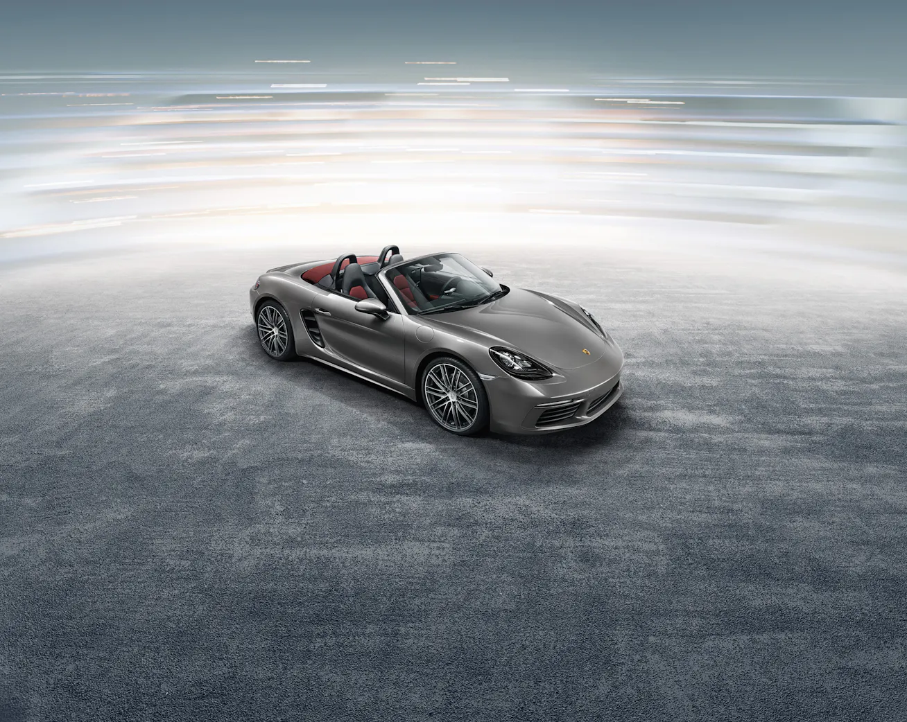 Porsche 718 Boxster overhead, side on view in studio