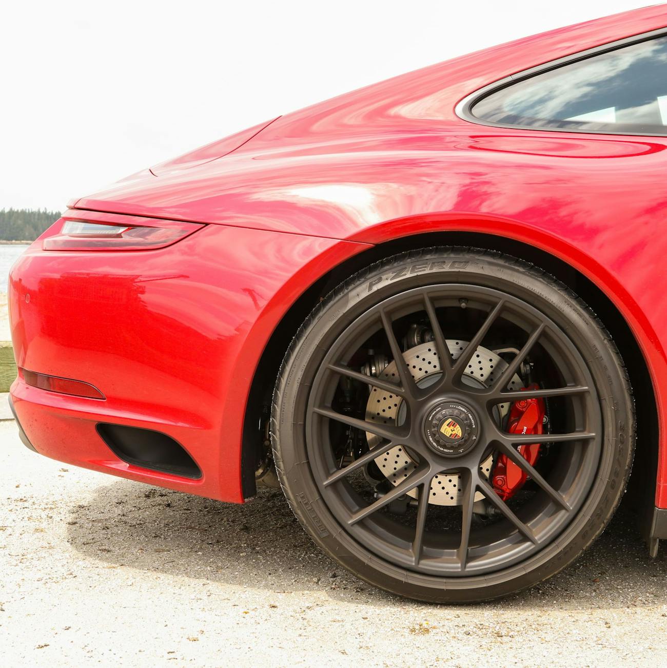 Carmine Red Porsche 911 Carrera 4 GTS side rear view