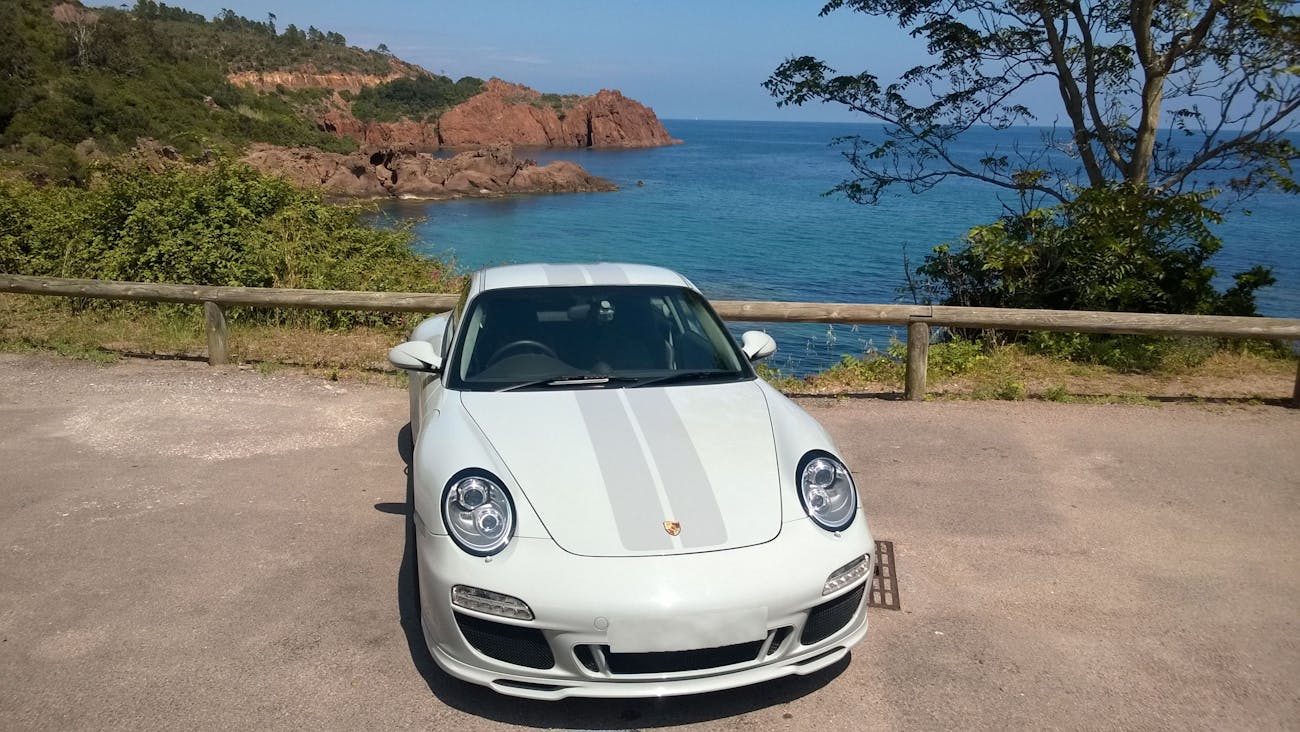 Grey 2009 Porsche 911 Sport Classic by rocky Mediterranean coastline