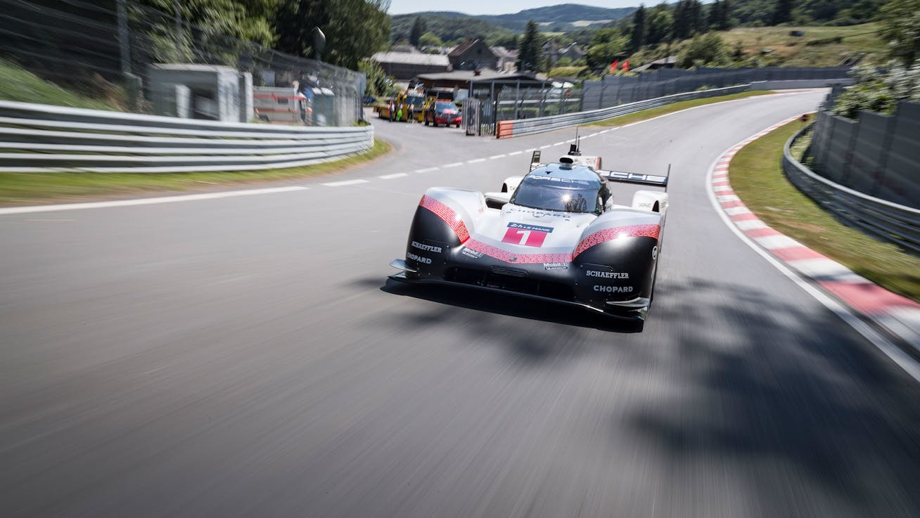 Porsche 919 Hybrid Evo driving through a corner on the Nürburgring Nordschleife