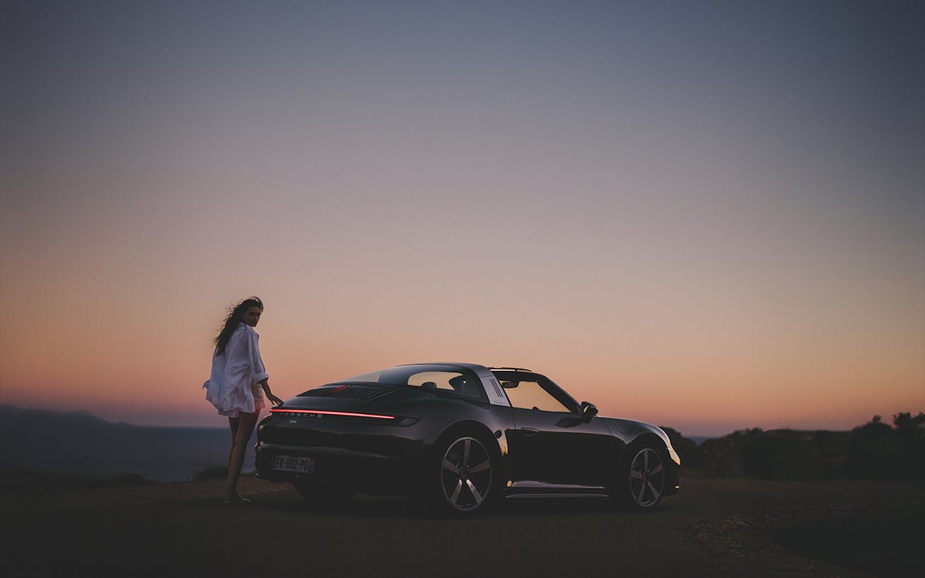 Porsche 911 in nature at sunset
