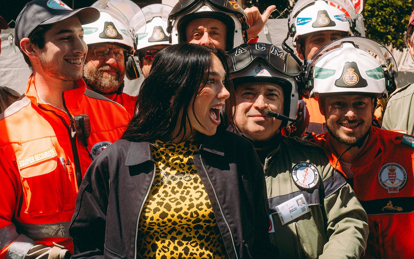 Dua Lipa with emergency services personnel in Monaco