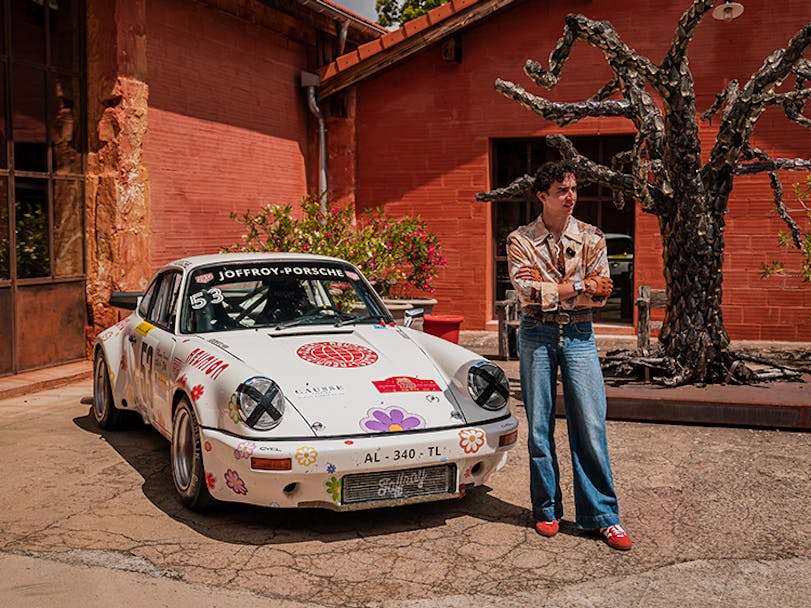 Man with flower power Porsche 911 art car 