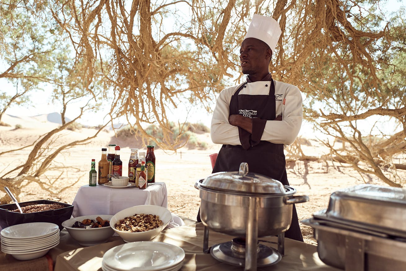 Chef at the breakfast buffet in the desert