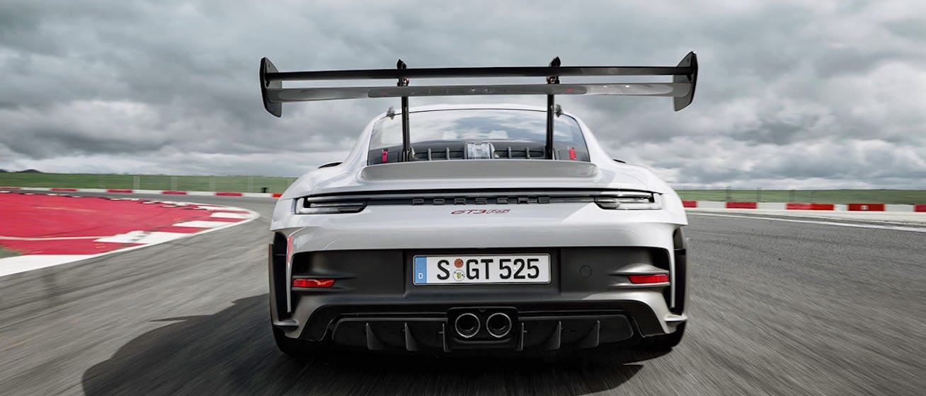 White Porsche 911 GT3 RS on racetrack