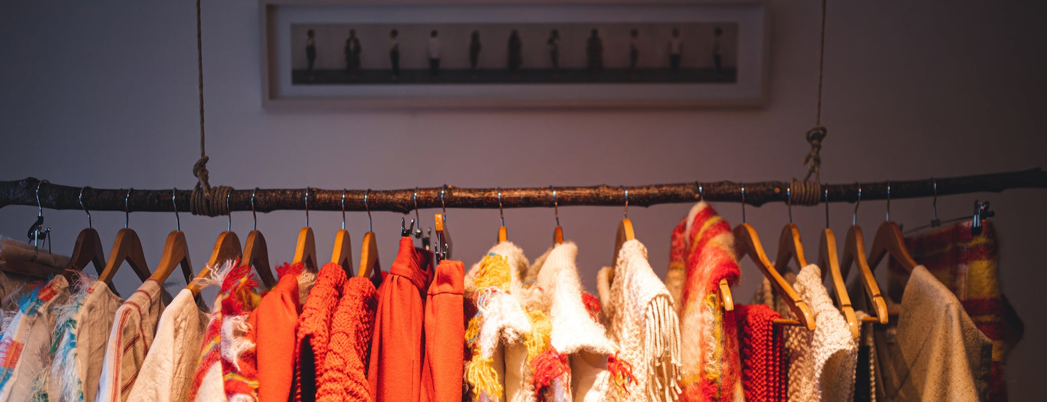 Clothes rail with colourful garments hanging from it