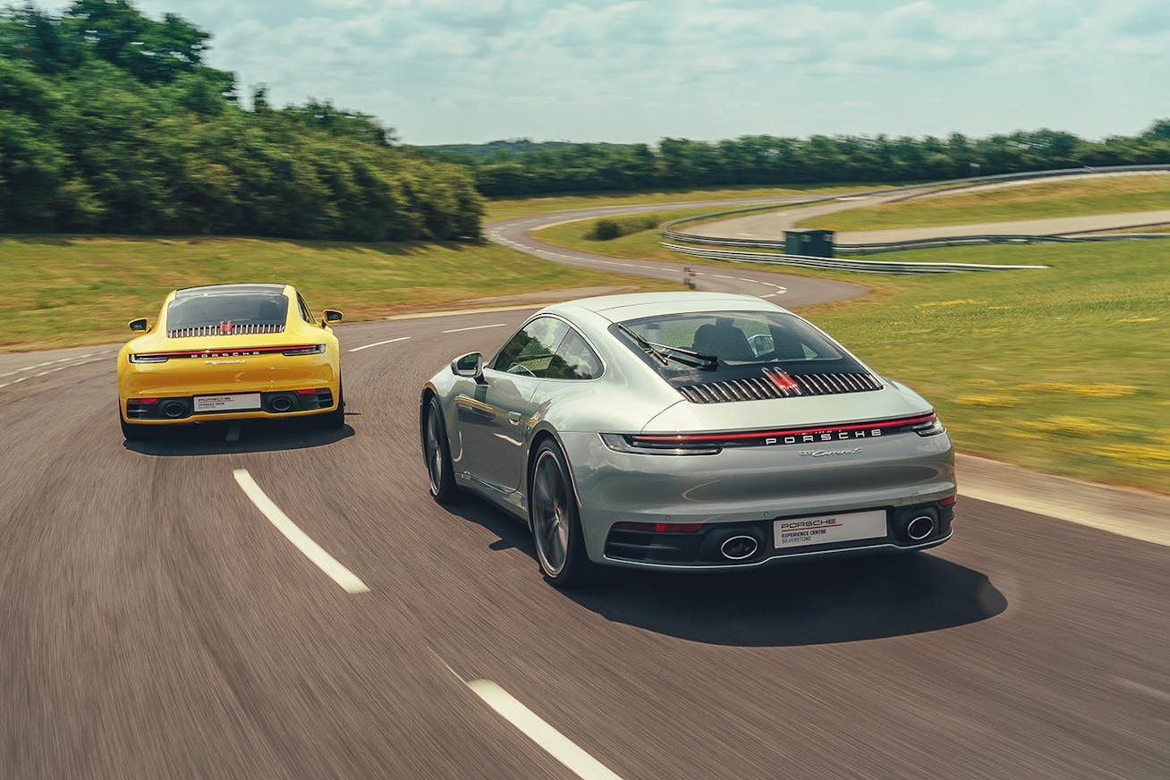 Two 911 sportscars on track at Porsche Experience Centre Silverstone