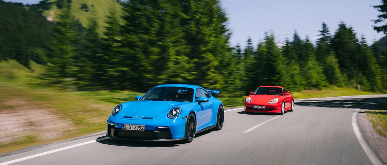 911 (996) GT3 and 911 (992) GT3 driving up mountain pass