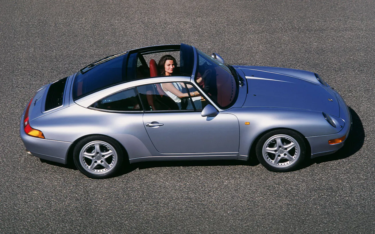 Woman sits at wheel of 1997 911 Targa 3.6 (type 993)