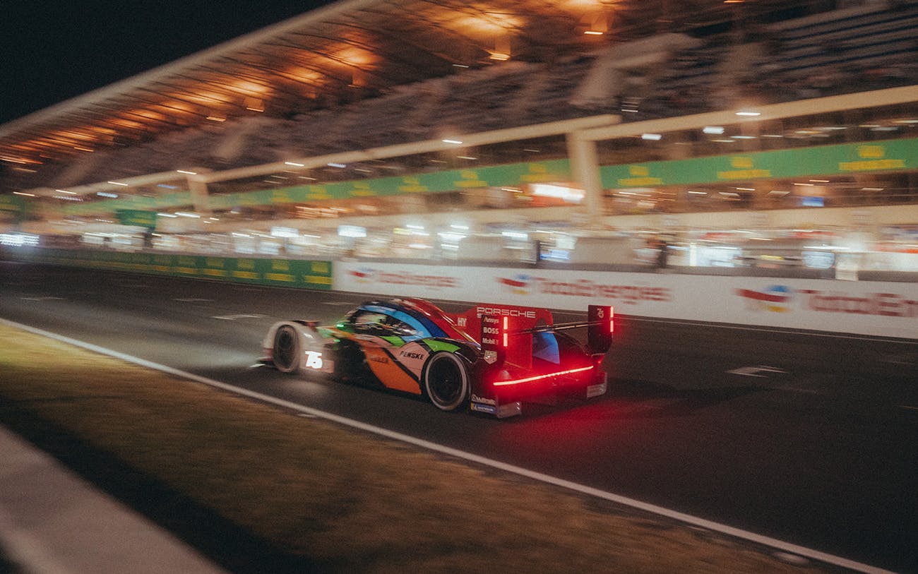 Porsche 963 racing at night at Le Mans