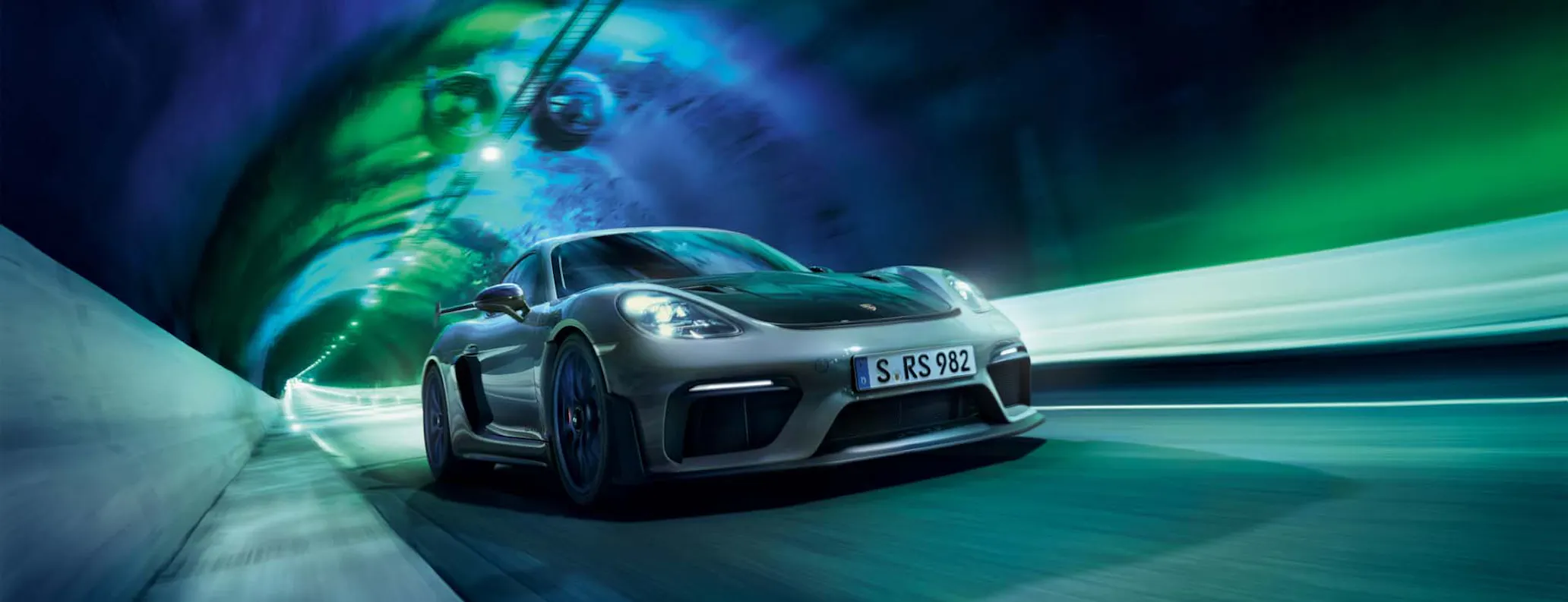 Porsche Cayman GT4 RS driving through tunnel hero desktop