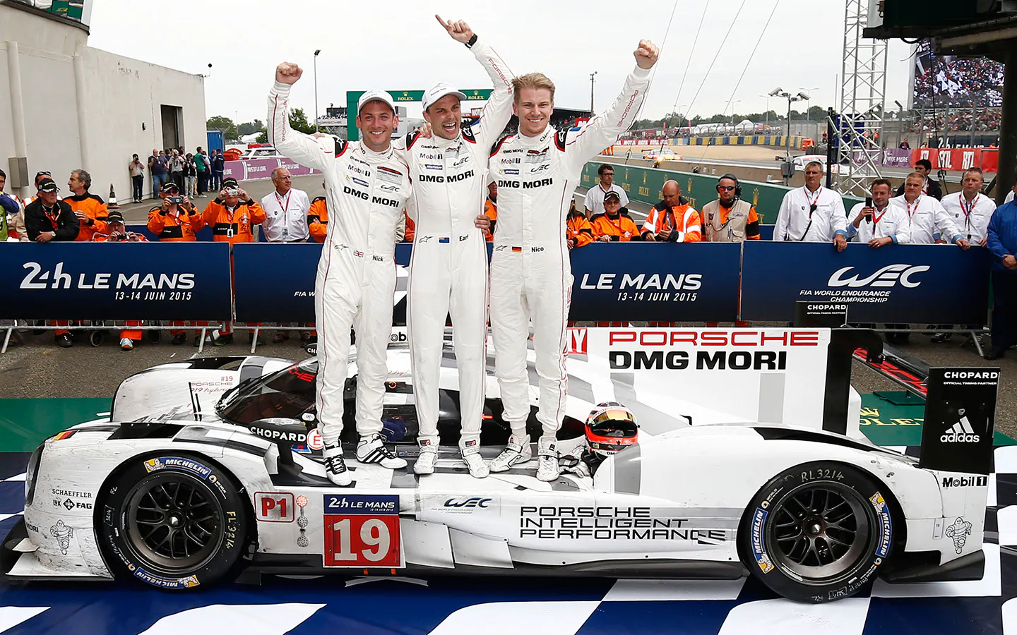 Porsche 919 Hybrid 2015 Le Mans winner drivers Earl Bamber, Nick Tandy, Nico Hülkenberg celebrating after race