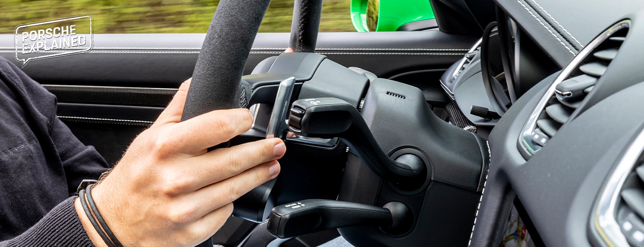 Hands engaging PDK shift on Porsche 718 Boxster GTS 4.0