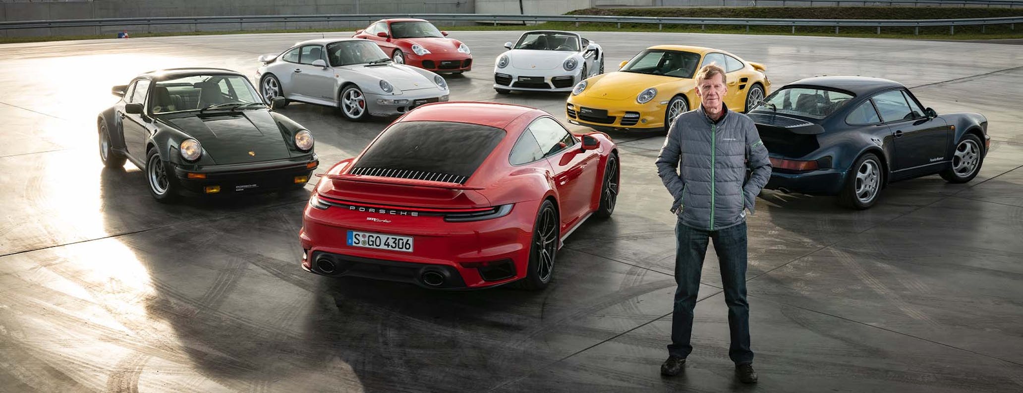 Walter Röhrl with different generations of Porsche 911 Turbo