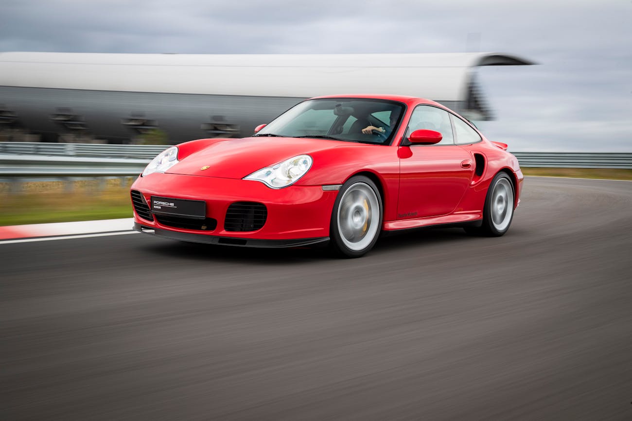 Front view of red Porsche 911 Turbo on racetrack
