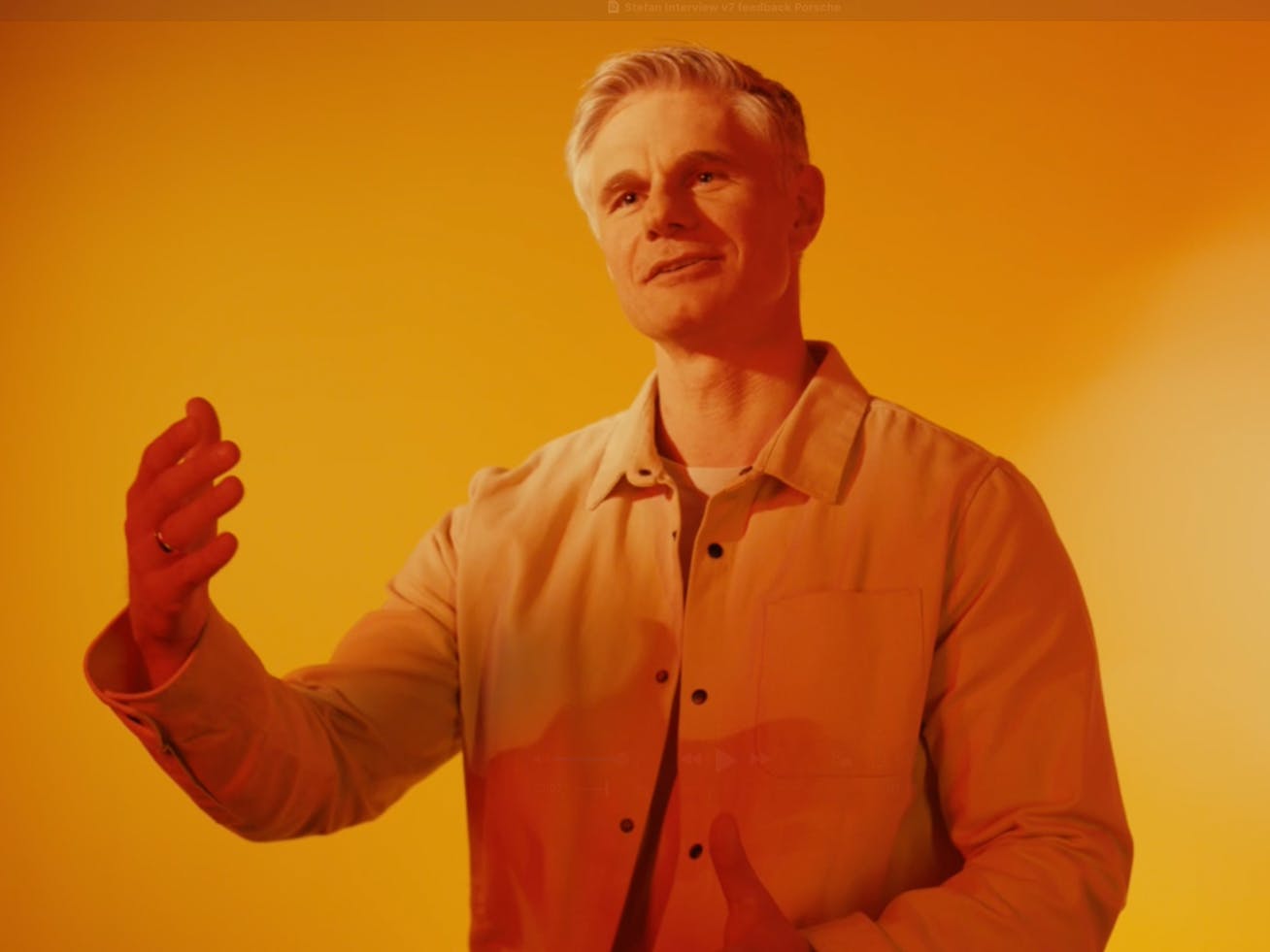 Man gesticulating with his hand in a studio