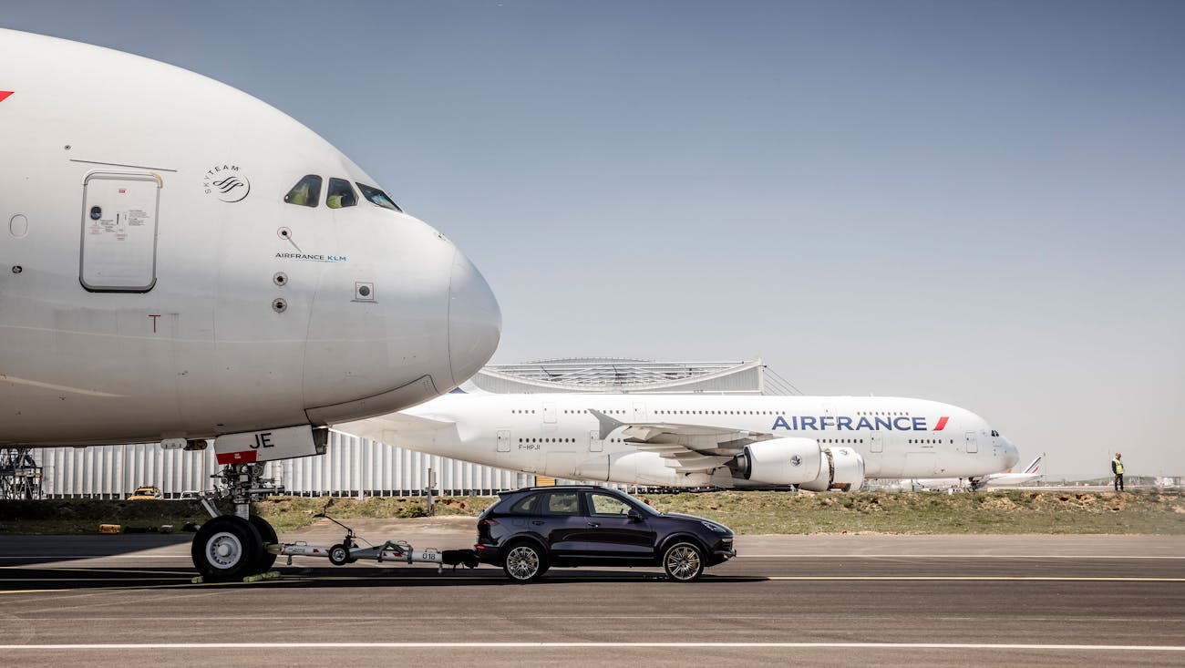 Porsche Cayenne towing an Airbus A380 aeroplane 