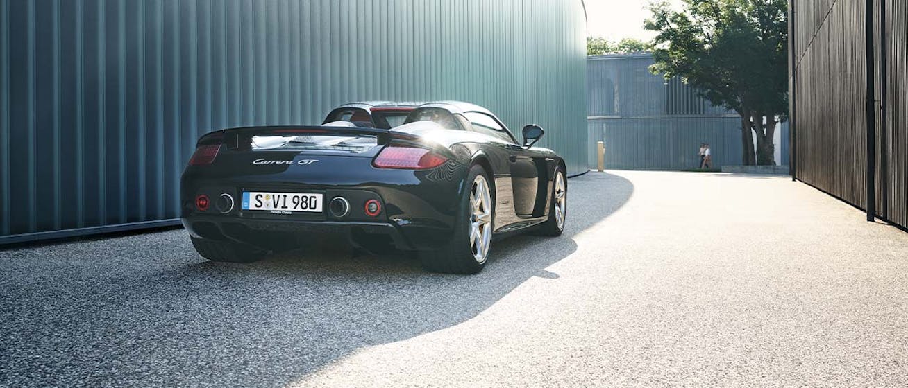 Rear view of black Porsche Carrera GT