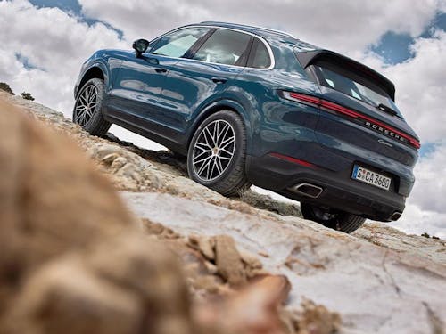 New 2023 Porsche Cayenne parked up on rocky terrain