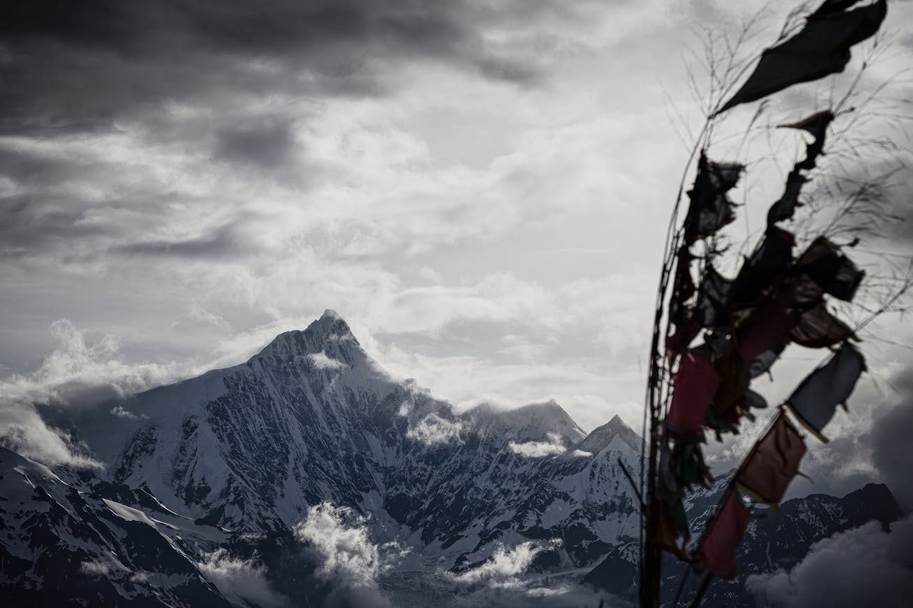 The sacred Tibetan mountain, Nyainqênkawagarbo, towers over the landscape