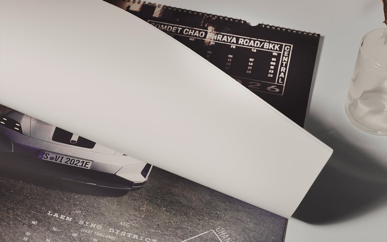 Porsche AHEAD 2026 Thailand wall calendar being opened 
