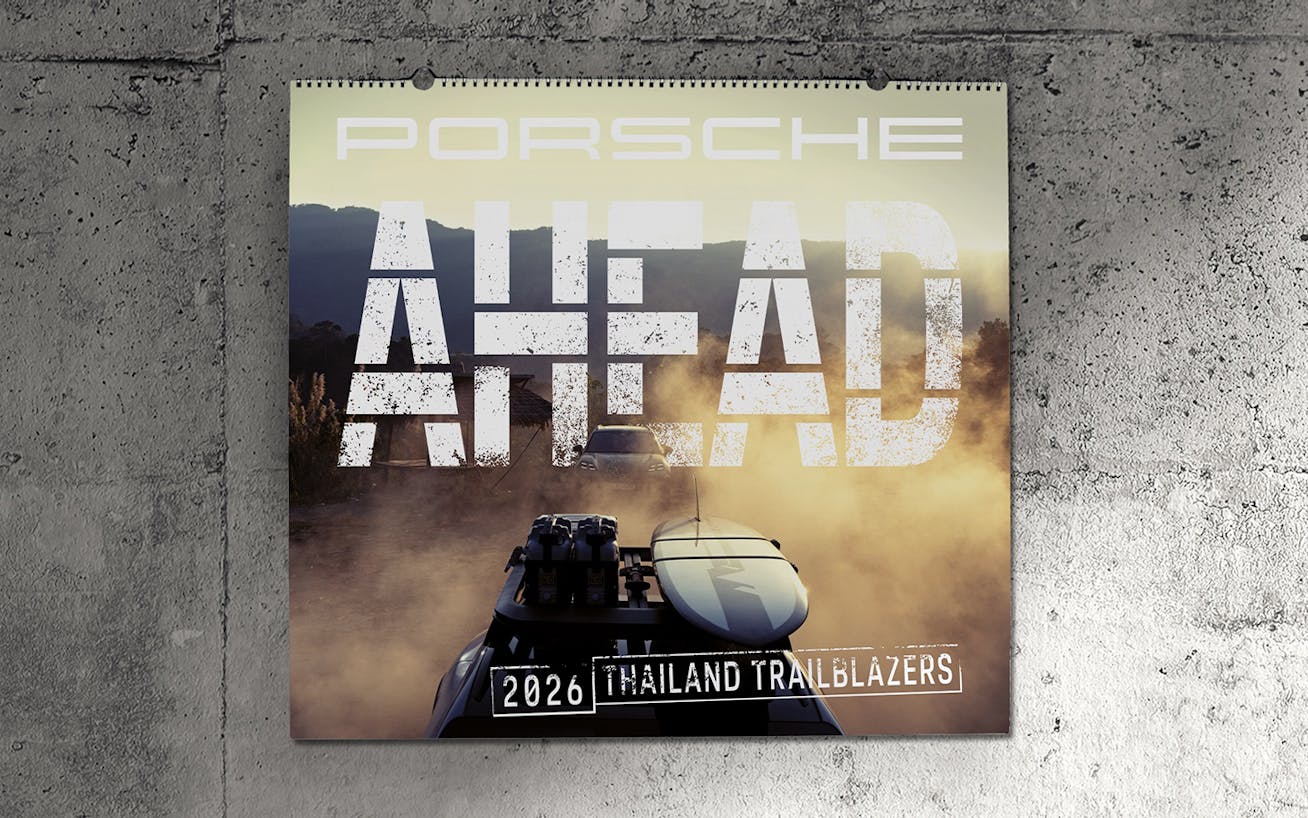 Porsche AHEAD 2026 Thailand wall calendar being opened 